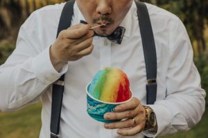 Groom eating shave ice