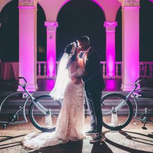 wedding couple kissing by bikes