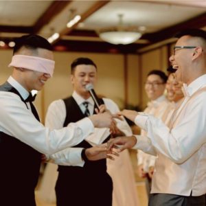 groom is blindfolded playing game