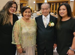 Wedding Planner with clients at a 50th wedding anniversary event