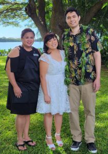 Couple and their wedding planner at a park in Hawaii