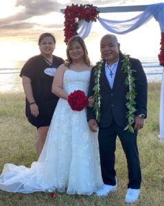 Newlywed couples with their wedding planner in Hawaii