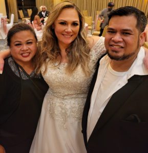 Bride Taking a Photo with Wedding Planner 808 team
