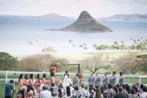 Wedding Ceremony at Paliku Gardens with Chinamans Hat Background