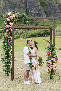 Couple Photoshoot Under Floral Wedding Arch