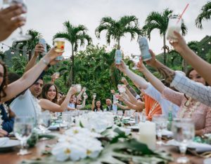 Wedding Party Cheersing at Decorative Table