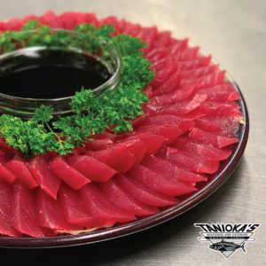 Platter of Tuna Sashimi with soy sauce by Taniokas
