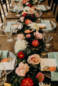 Floral Decorations on a Table at a Wedding Reception decorated by Tropical Moons Event
