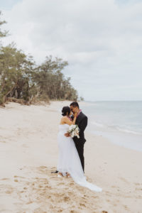 a Married couple Almost Kissing on the Beach captured by Rachel Kathryn