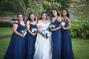 Bride and her Bridesmaids Smiling showcasing their hair and makeup by Wedding Hairstyles and Makeup