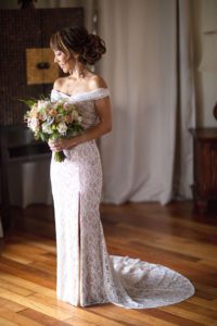 Bride in Wedding Dress holding a bouquet of flowers