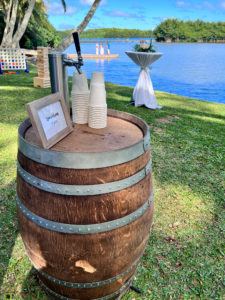 Aloha Taps decorative keg on a lawn by the water during a Hawaii Wedding