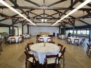 heeia state park banquet hall room with round tables surrounded by chairs