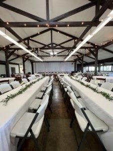 heeia state park banquet hall setup with long tabls covered in white cloth