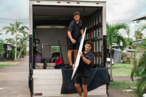 Namaka Staff carrying equipment to set up at a weddding